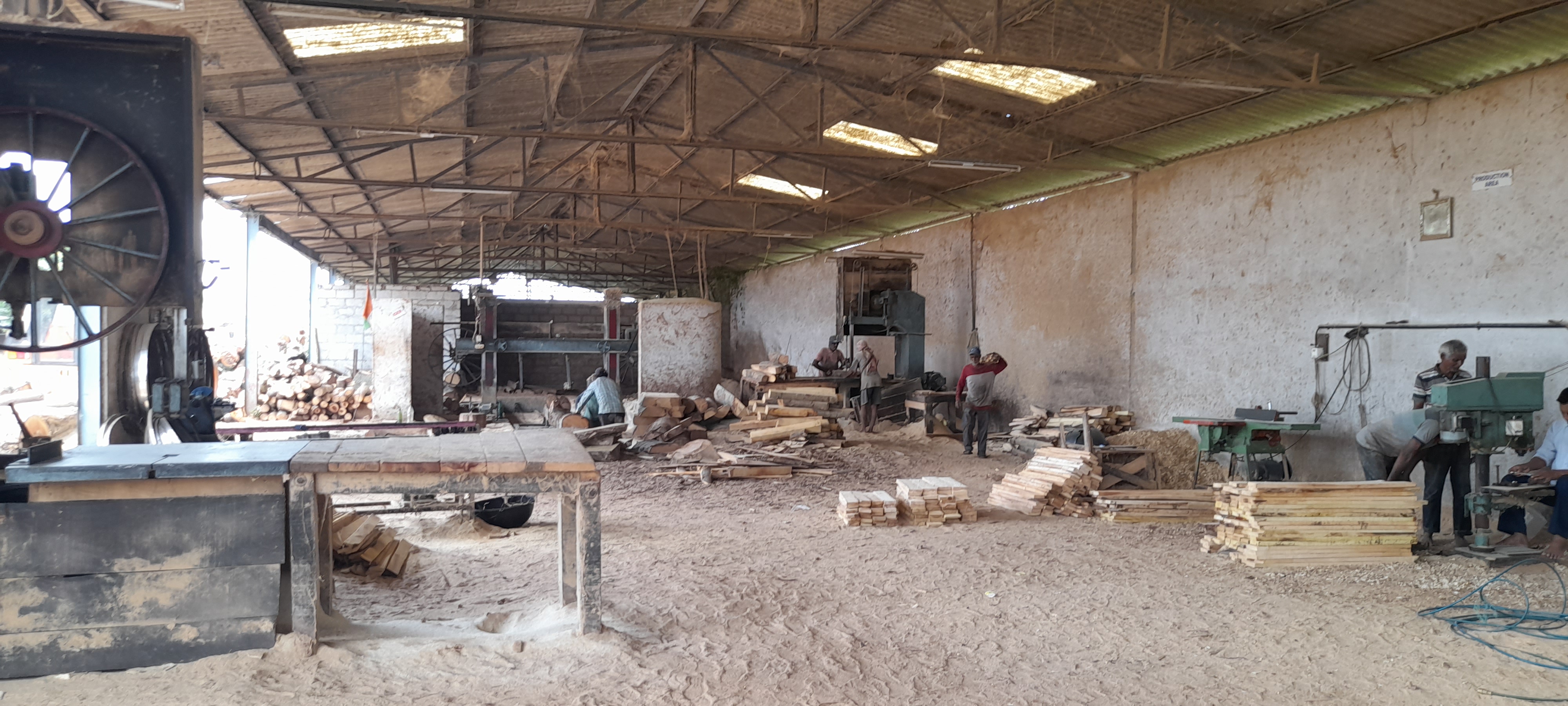 Kudur Timbers Saw Mill's facility with workers engaged in timber manufacturing and processing