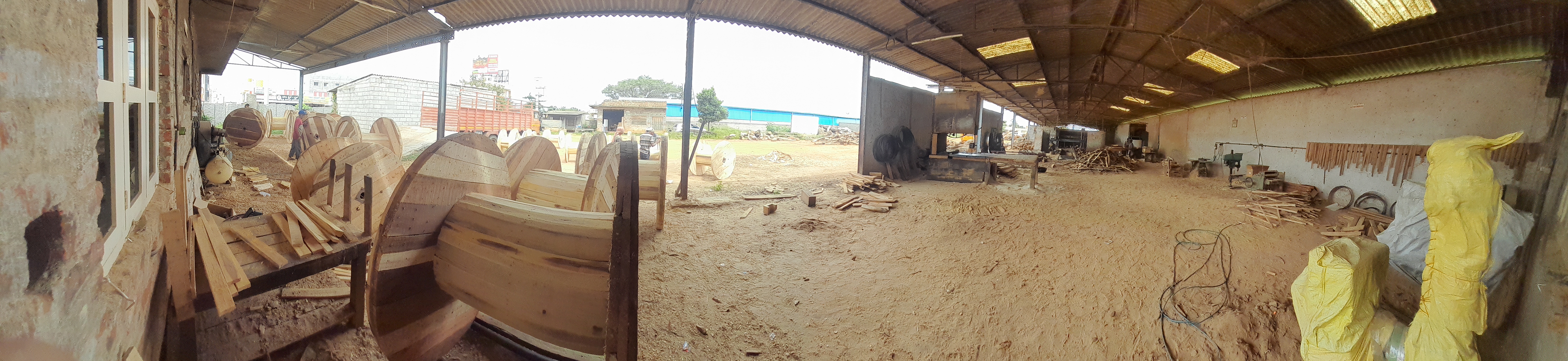 Wide-angle view of Kudur Timbers factory interior showcasing timber processing equipment and industrial layout